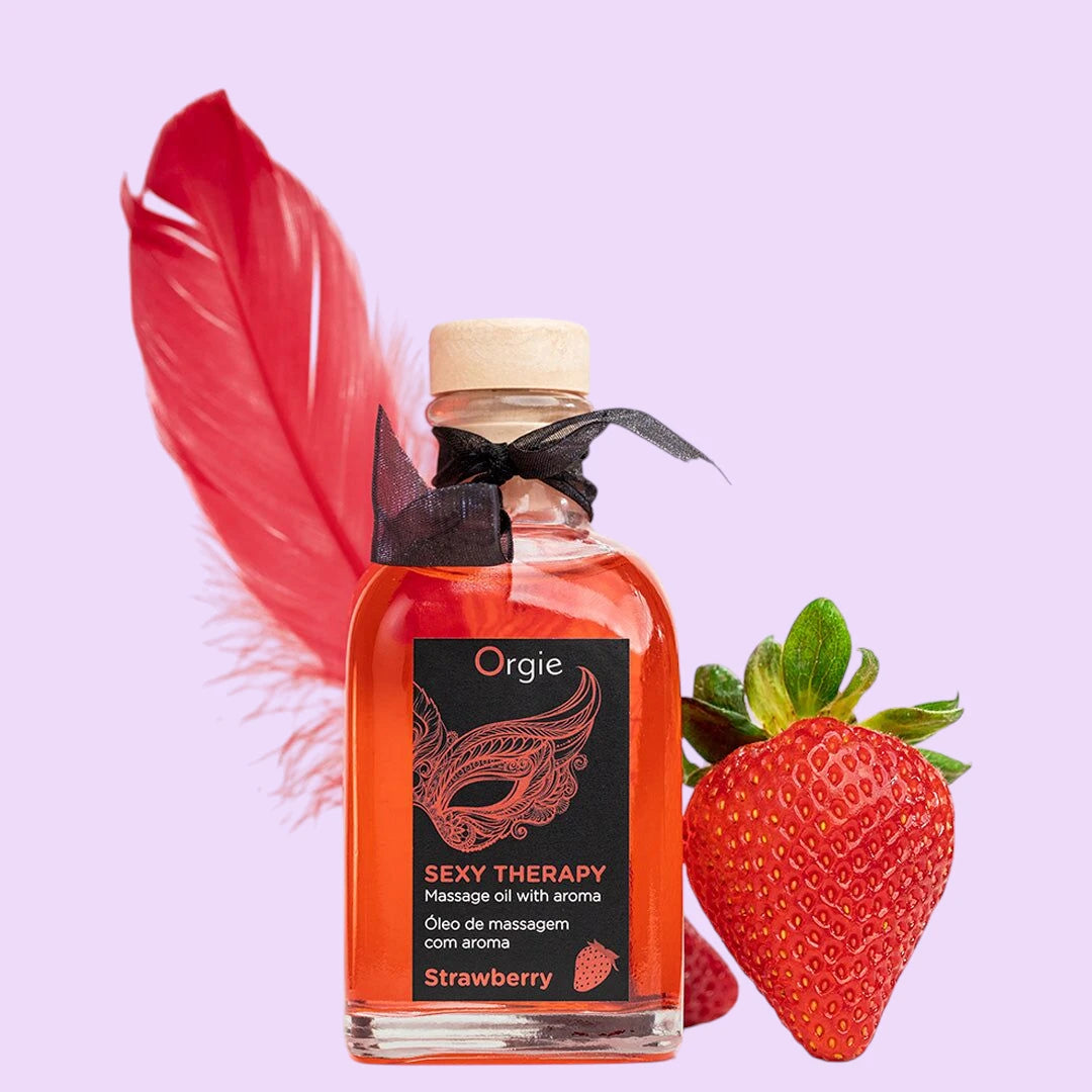 Набір для масажу Orgie – Sexy Therapy Strawberry (100 мл), їстівна розігрівальна олія + пір'їнка